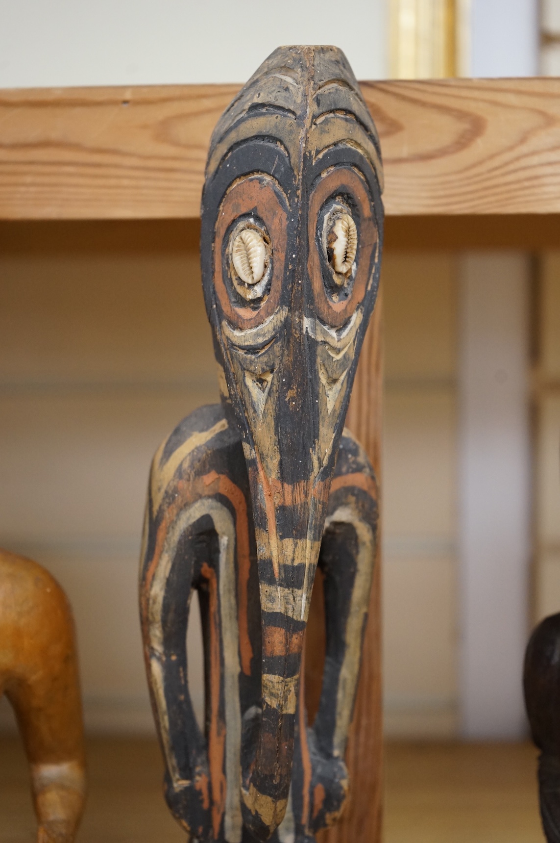 Three wood tribal figures, Africa, South Seas, tallest 37.5cm